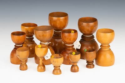 Lot 52 - A Collection of Turned Apothecary's Boxwood Measures