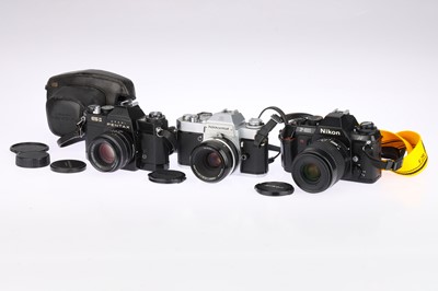 Lot 160 - Two Nikon and a Pentax 35mm SLR Cameras