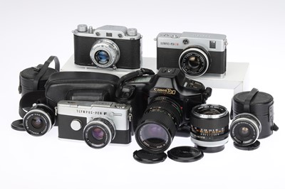 Lot 244 - An Olympus Pen FT and Lenses