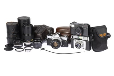 Lot 108 - An Olympus OM-1 MD 35mm SLR Camera with Three Lenses