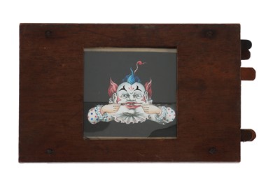 Lot 456 - A Complex Magic Lantern Slide of a Clowns Face