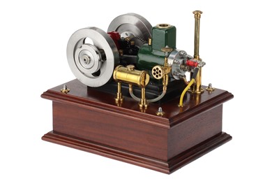 Lot 194 - the engine with mounted on a polished oak base,...