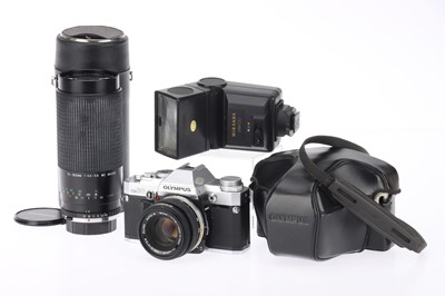 Lot 183 - An Olympus OM-30 35mm SLR Camera Outfit