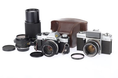 Lot 139 - An Olympus OM20 35mm SLR Camera and Lenses