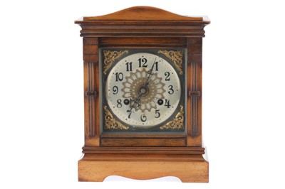 Lot 818 - A Victorian Walnut and Stained Beech Mantle Clock