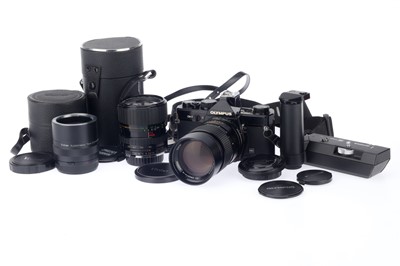 Lot 70 - An Olympus OM-2 MD Camera and Vivitar Lenses