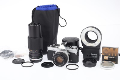 Lot 87 - An Olympus OM-1 MD 35mm SLR Camera Outfit