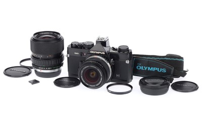 Lot 76 - An Olympus OM-2N MD 35mm SLR Camera Outfit