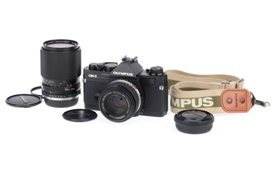 Lot 77 - An Olympus OM-2 Spot/Program 35mm SLR Camera Outfit