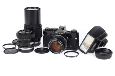 Lot 78 - An Olympus OM-1 35mm SLR Camera Outfit