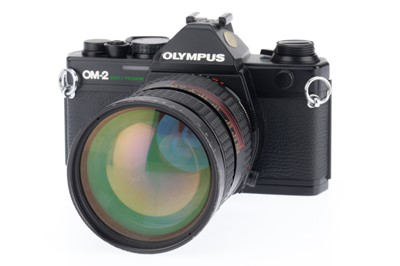 Lot 148 - An Olympus OM-2 Spot/Program 35mm SLR Camera