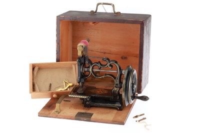 Lot 473 - A Wilcox and Gibbs Portable Sewing Machine