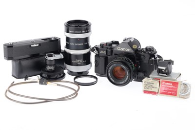 Lot 129 - A Canon A-1 35mm SLR Camera and Accessories