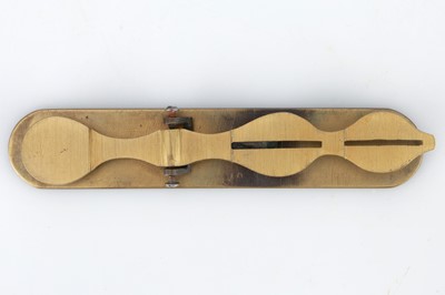 Lot 378 - An unusual lacquered and anodised brass Sovereign Rocker Coin Scale