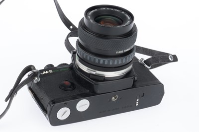 Lot 186 - An Olympus OM-2 Spot Program slr Camera Outfit