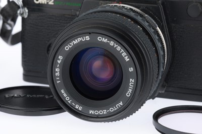 Lot 186 - An Olympus OM-2 Spot Program slr Camera Outfit