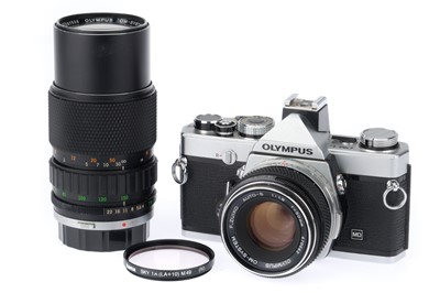 Lot 247 - An Olympus OM-1N 35mm SLR Camera Outfit