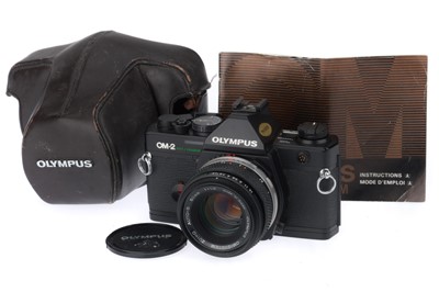 Lot 128 - An Olympus OM-2 Spot/Program 35mm SLR Camera