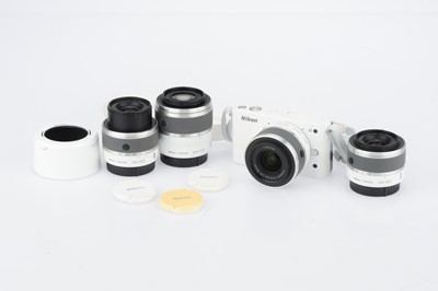 Lot 145 - A Nikon 1 J2 Compact Digital Camera Outfit