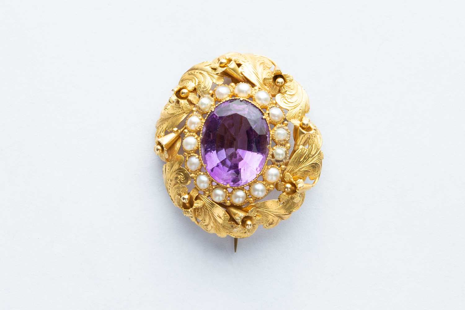 Lot 32 - A 18ct Yellow Gold Amethyst & Seed Pearl Floral Brooch