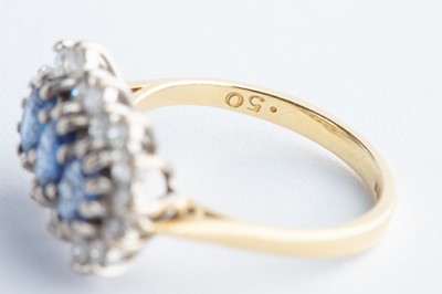 Lot 33 - A 18ct Yellow Gold Three Stone Sapphire & Diamond Cluster Ring