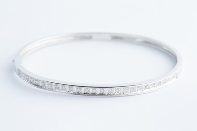 Lot 37 - A 9ct White Gold & Diamond Bangle Bracelet