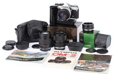 Lot 257 - An Olympus OM-2N 35mm SLR Camera Outfit