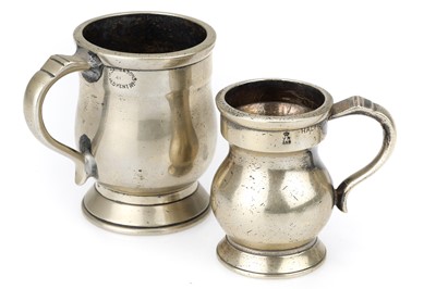 Lot 701 - 2 White Metal Pub Measures