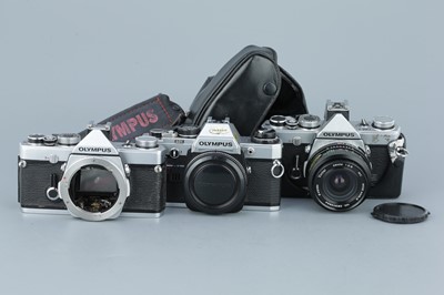 Lot 279 - Three Olympus OM SLR Cameras