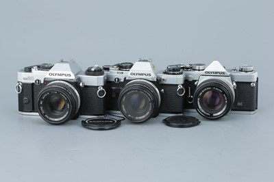 Lot 280 - Three Olympus OM SLR Cameras