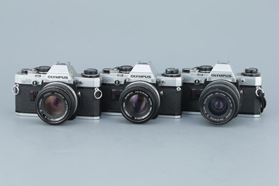 Lot 284 - Three Olympus OM10 SLR Cameras