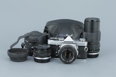 Lot 283 - An Olympus OM-1 SLR Outfit