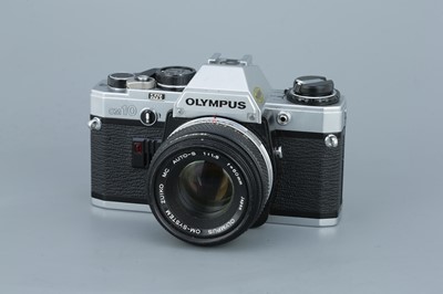 Lot 271 - Three Olympus OM SLR Cameras