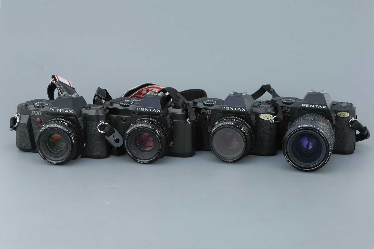 Lot 322 - Four Pentax SLR Cameras