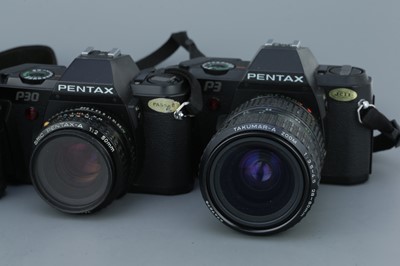 Lot 322 - Four Pentax SLR Cameras