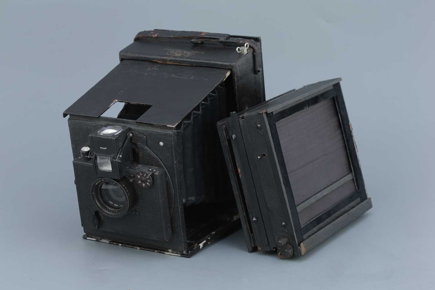 Struts Camera Lot 674 - An Adams Idento Folding Strut Camera,